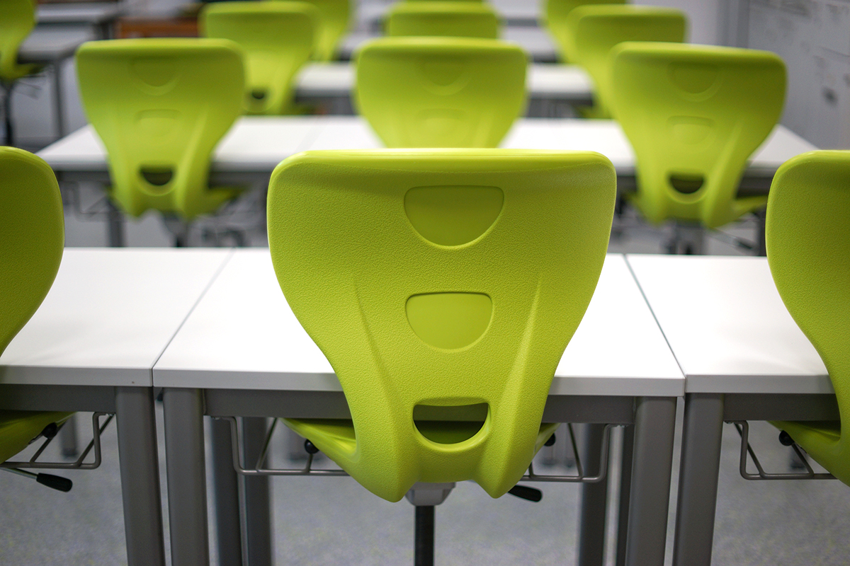 classroom filled with ergonomic green chairs in the classroom